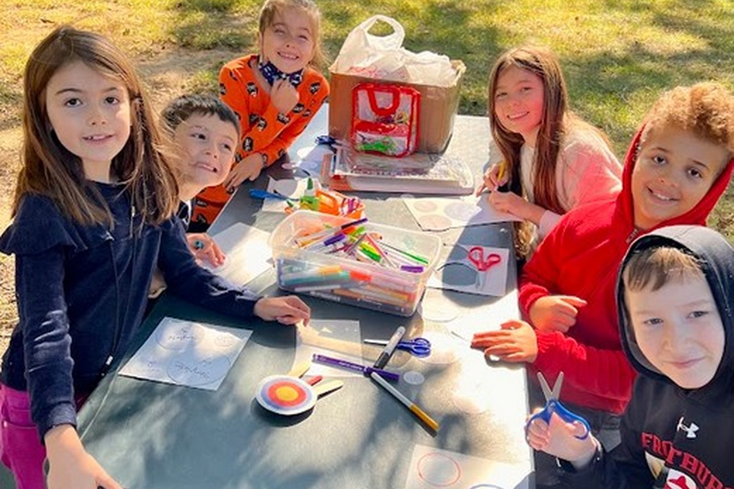 Children learning together outdoors